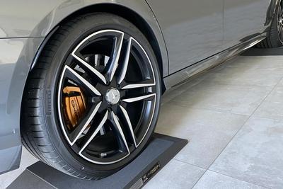 Mercedes E Class model 63 AMG on ALTairEGO tyre cushions set, laying inside the garage